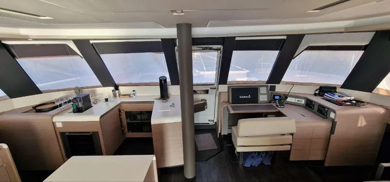 Tbd Yacht Photos Pics Luxurious interior of 2022 Fountaine Pajot Samana 59 yacht with modern navigation equipment.