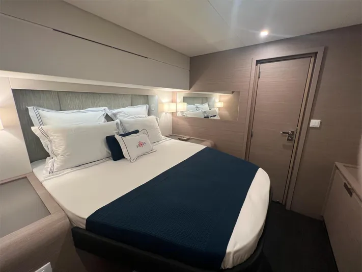 Tbd Yacht Photos Pics Luxurious bedroom interior of 2022 Fountaine Pajot Samana 59 yacht with elegant bedding.