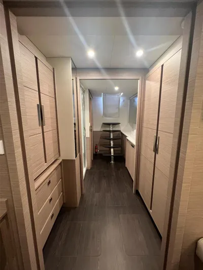 Tbd Yacht Photos Pics Interior of 2022 Fountaine Pajot Samana 59 yacht, featuring modern wood cabinetry and sleek design.