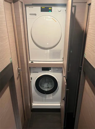 Tbd Yacht Photos Pics Laundry area with stacked washer and dryer in 2022 Fountaine Pajot Samana 59 yacht.
