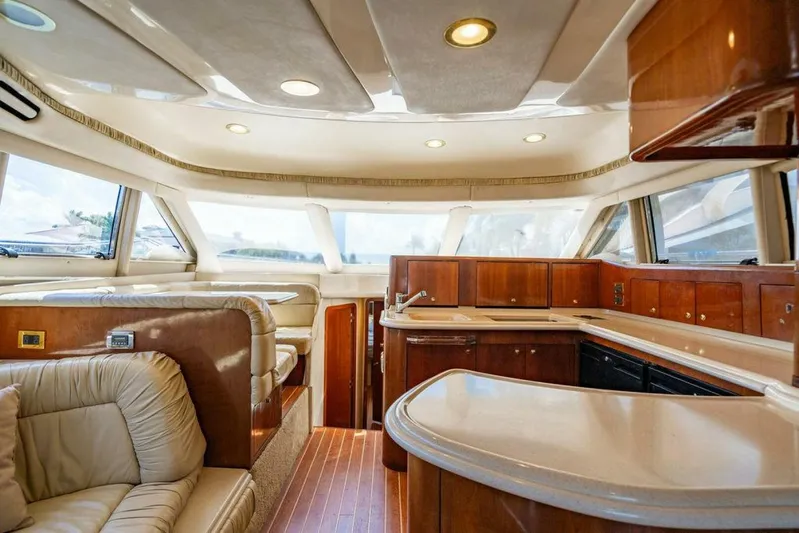 Southern Seas Yacht Photos Pics Luxurious interior of 1999 Sea Ray 56 Sedan Bridge yacht with elegant wood finishes.