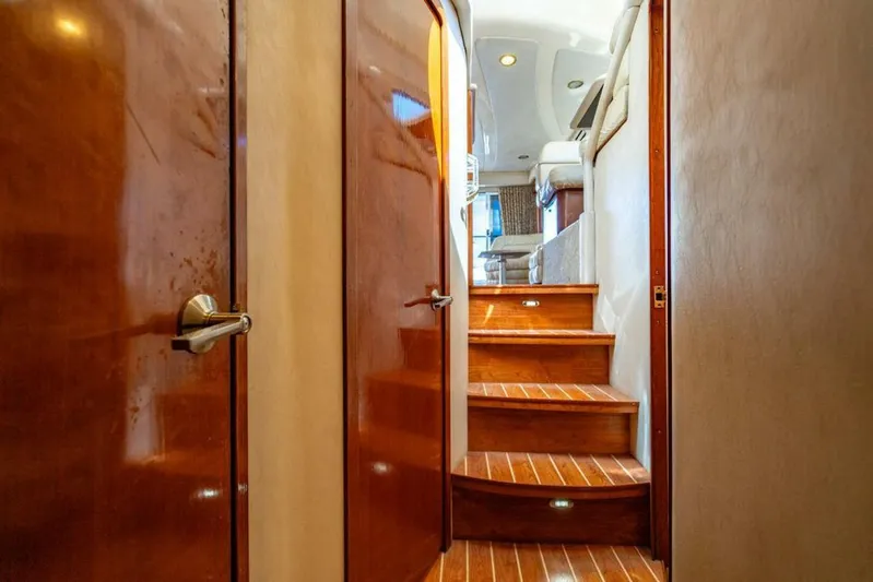 Southern Seas Yacht Photos Pics Interior of 1999 Sea Ray 56 Sedan Bridge with wooden stairs and doors.