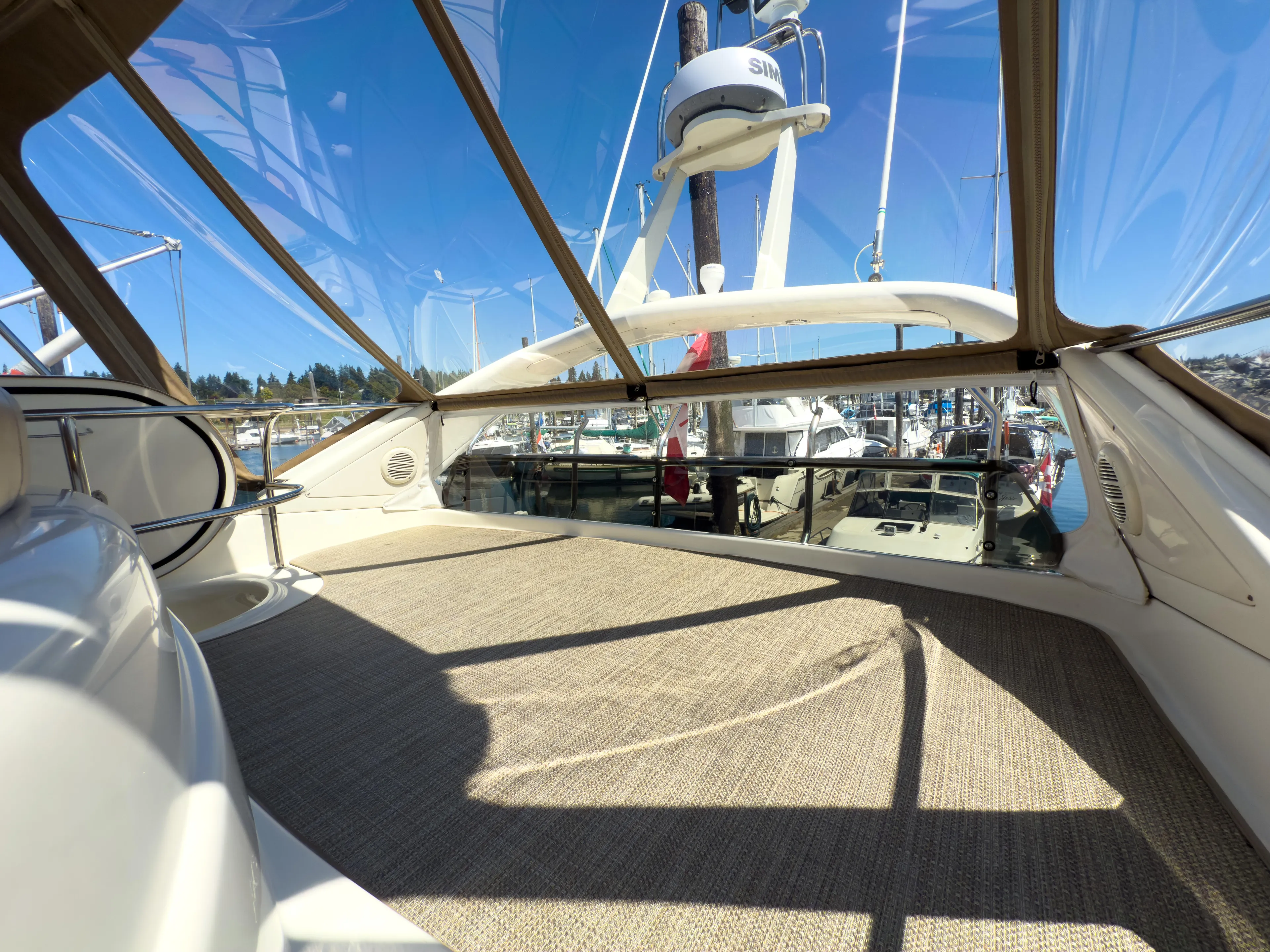 Italian Job Yacht Photos Pics 2001 Cranchi Atlantique yacht interior with panoramic marina view.