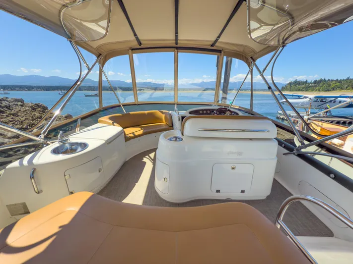 Italian Job Yacht Photos Pics Interior view of 2001 Cranchi Atlantique yacht with scenic ocean backdrop.