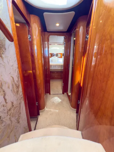 Italian Job Yacht Photos Pics Interior hallway of 2001 Cranchi Atlantique yacht with polished wood finish.