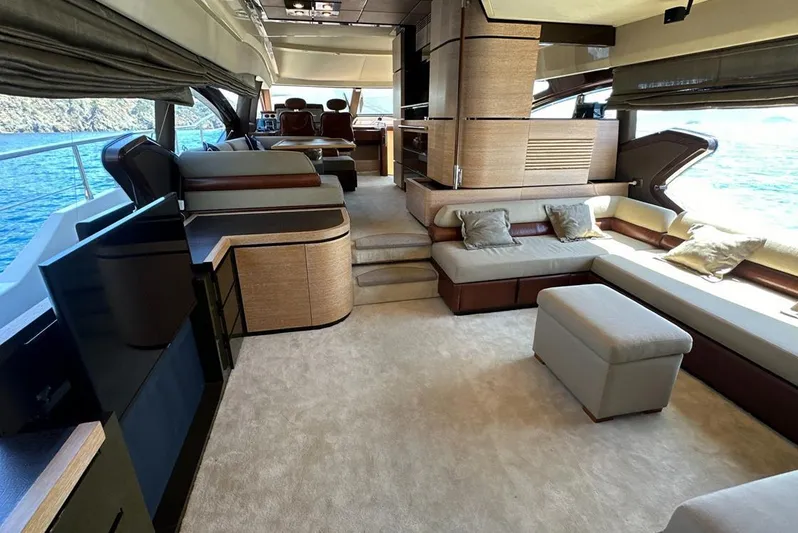  Yacht Photos Pics Luxurious interior of a 2010 Azimut 70 yacht with elegant seating and panoramic windows.