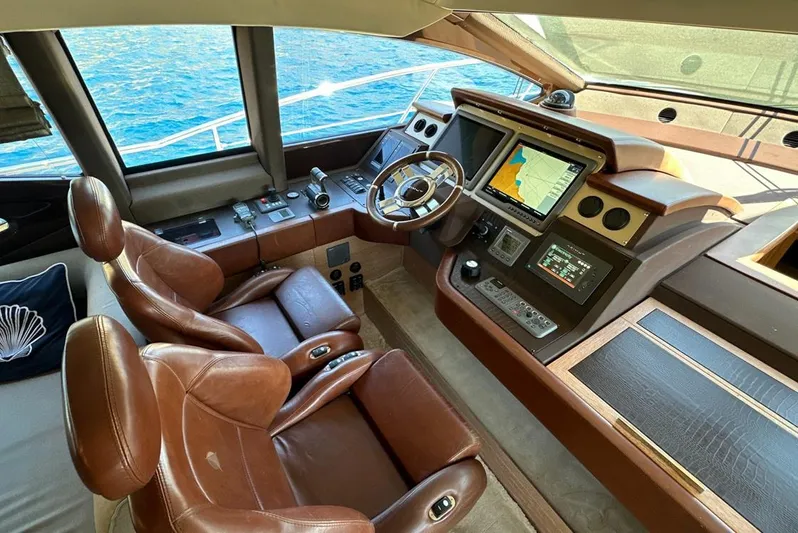  Yacht Photos Pics Luxurious 2010 Azimut 70 yacht cockpit with leather seats and advanced navigation system.