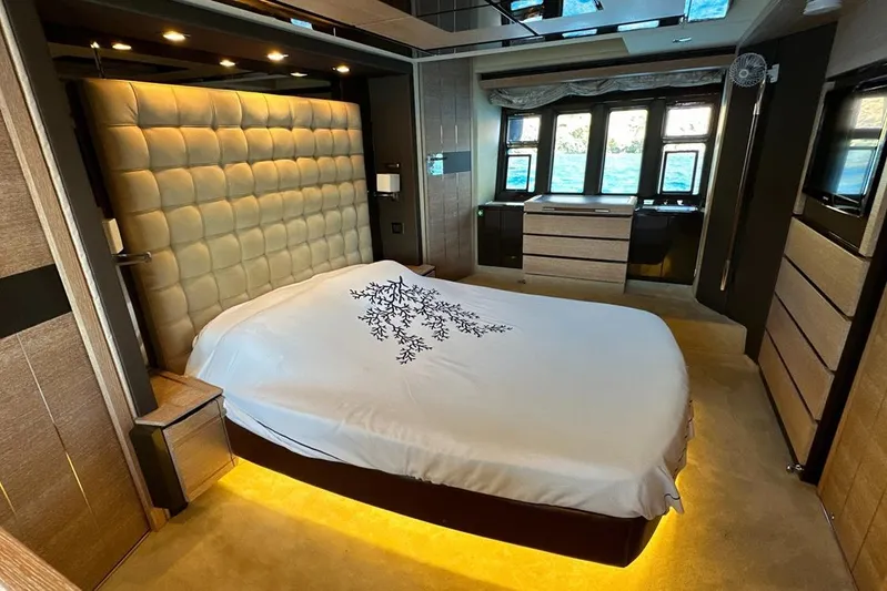  Yacht Photos Pics Luxurious bedroom interior on a 2010 Azimut 70 yacht, featuring elegant lighting and modern design.
