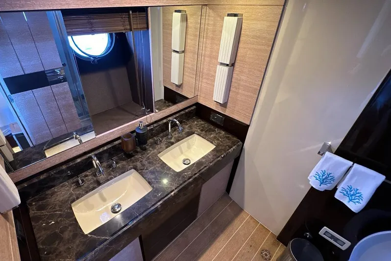  Yacht Photos Pics Luxurious bathroom in 2010 Azimut 70 yacht with dual sinks and elegant fixtures.