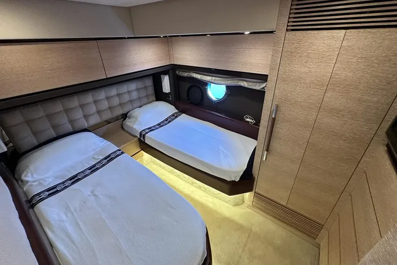  Yacht Photos Pics Interior of 2010 Azimut 70 yacht cabin with twin beds and modern design.