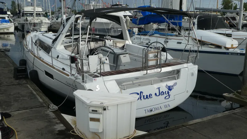  Yacht Photos Pics Beneteau Oceanis 41 sailboat docked at marina, 2014 model, named "Blue Jay".