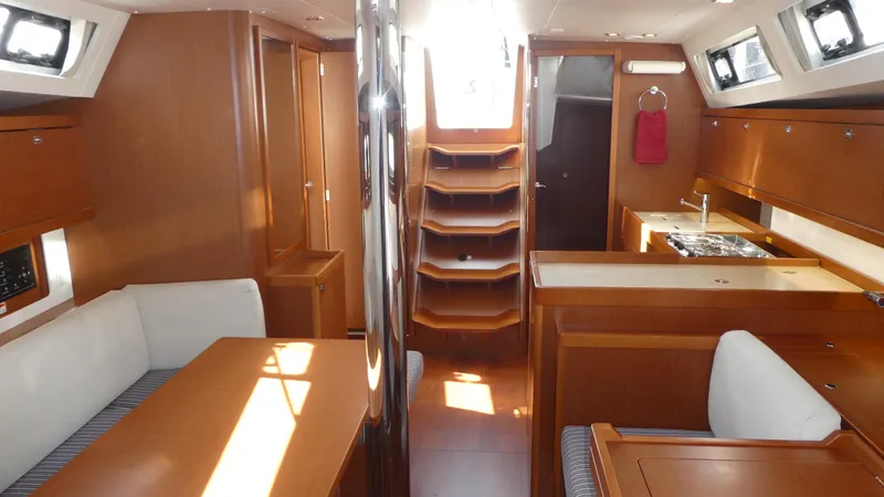  Yacht Photos Pics Interior of 2014 Beneteau Oceanis 41 sailboat with wood finish and modern amenities.
