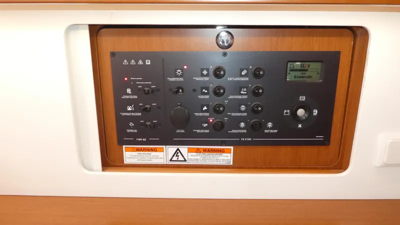  Yacht Photos Pics Control panel of a 2014 Beneteau Oceanis 41 sailboat, featuring various switches and indicators.