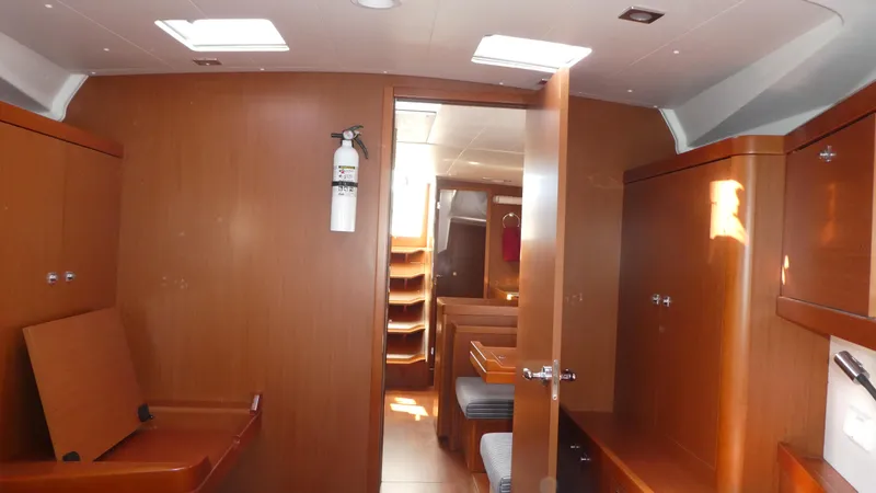  Yacht Photos Pics Interior of 2014 Beneteau Oceanis 41 sailboat with wooden cabinetry and seating.