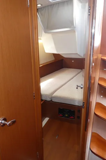  Yacht Photos Pics 2014 Beneteau Oceanis 41 cabin interior with bed and wooden finishes.