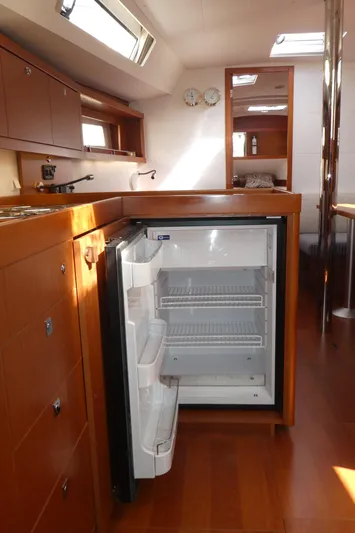  Yacht Photos Pics Interior of 2014 Beneteau Oceanis 41 yacht with open fridge in the galley.