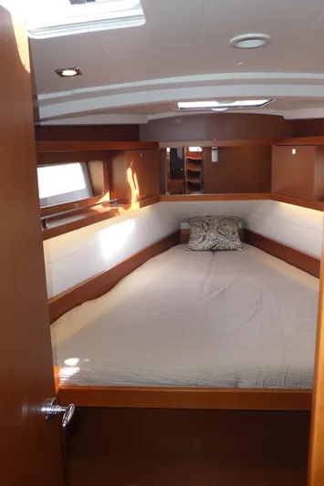  Yacht Photos Pics 2014 Beneteau Oceanis 41 cabin interior with bed, wooden finish, and natural light.