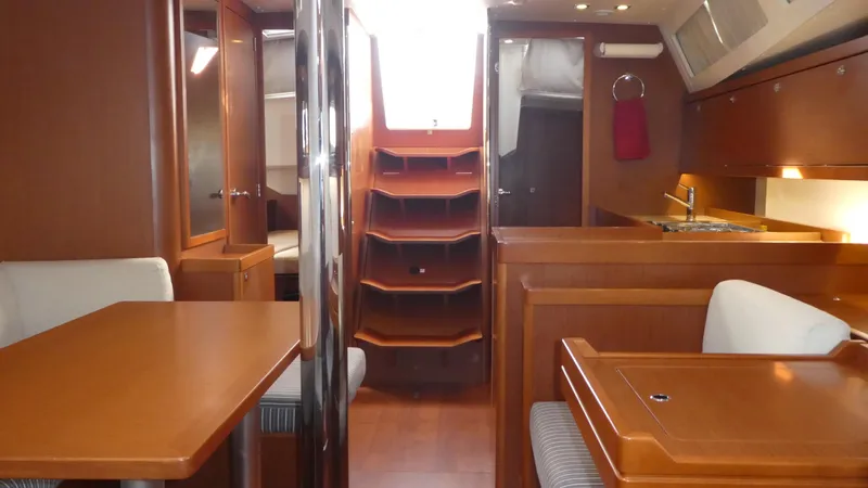  Yacht Photos Pics Interior of 2014 Beneteau Oceanis 41 sailboat with wood finish and seating area.