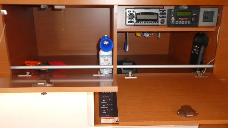  Yacht Photos Pics Navigation station on 2014 Beneteau Oceanis 41 yacht with radio equipment and storage.