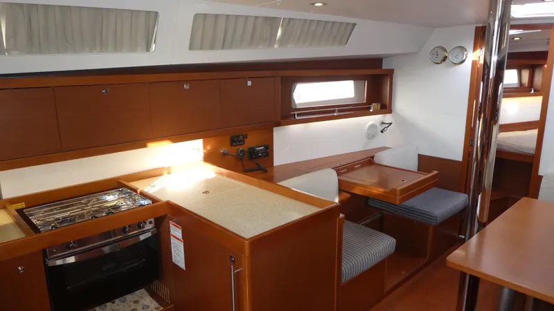  Yacht Photos Pics Interior of 2014 Beneteau Oceanis 41 yacht with kitchen and dining area.