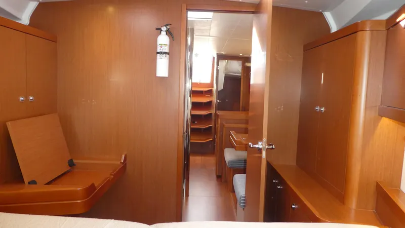  Yacht Photos Pics Interior of 2014 Beneteau Oceanis 41 yacht with wooden cabinetry and seating.
