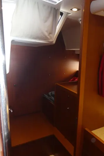  Yacht Photos Pics Interior cabin of 2014 Beneteau Oceanis 41 sailboat, featuring wooden finishes and natural light.