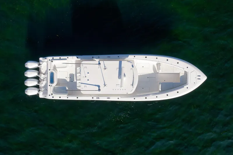  Yacht Photos Pics Aerial view of 2022 Invincible 39 Open Fisherman boat on clear water.