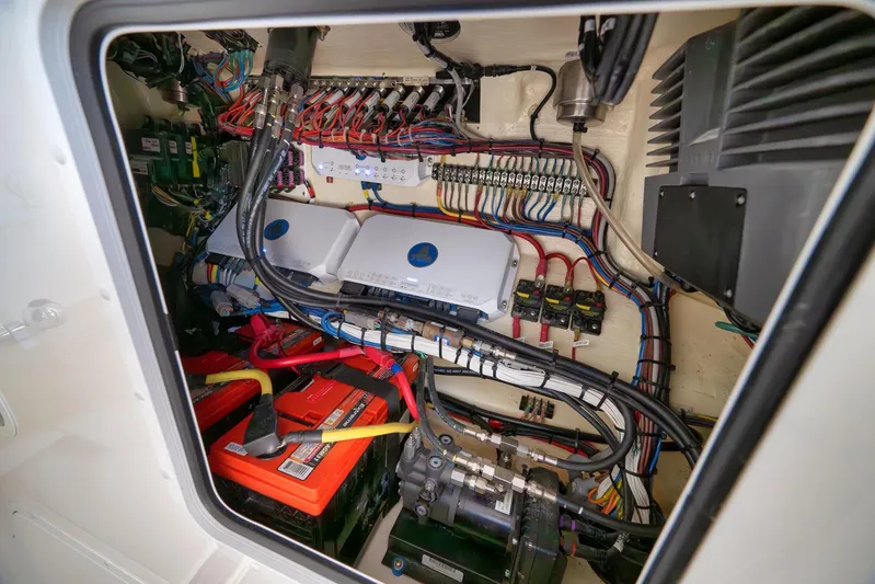  Yacht Photos Pics Electrical system inside 2022 Invincible 39 Open Fisherman boat, showcasing wiring and components.