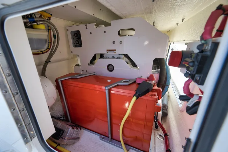  Yacht Photos Pics 2022 Invincible 39 Open Fisherman boat engine compartment with red battery and wiring.
