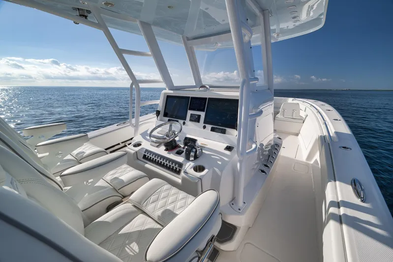  Yacht Photos Pics 2022 Invincible 39 Open Fisherman boat interior with modern helm and ocean view.