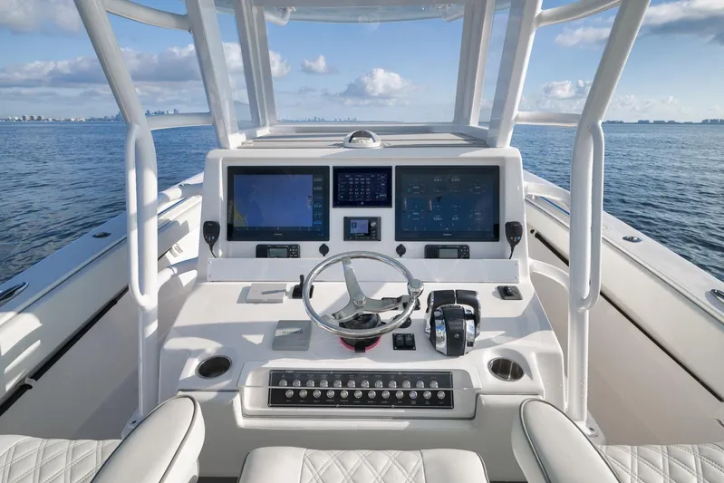  Yacht Photos Pics 2022 Invincible 39 Open Fisherman boat helm with advanced navigation displays.