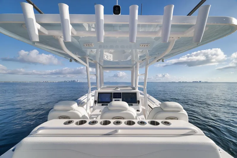  Yacht Photos Pics 2022 Invincible 39 Open Fisherman boat on calm ocean waters under blue sky.