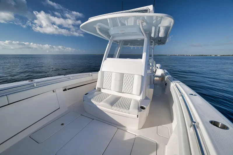  Yacht Photos Pics 2022 Invincible 39 Open Fisherman boat on calm ocean waters.
