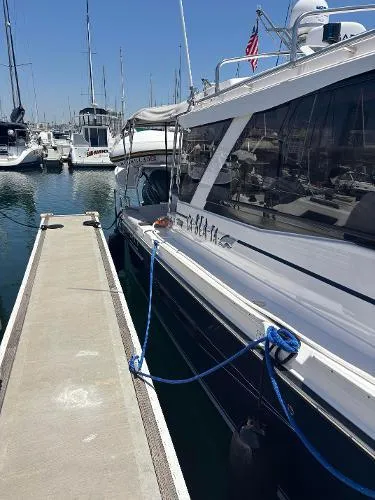  Yacht Photos Pics 2024 Cutwater C-32 C yacht docked at marina with blue ropes.