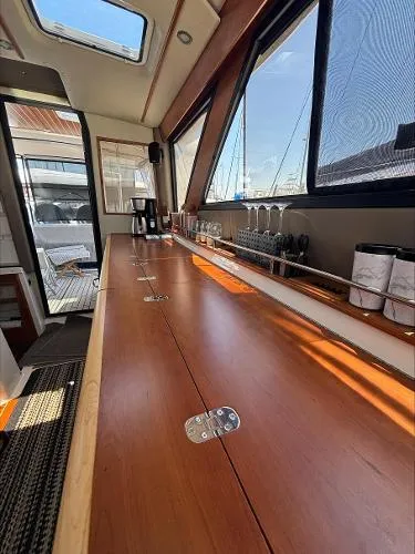  Yacht Photos Pics 2024 Cutwater C-32 C interior with wooden countertop and large windows.