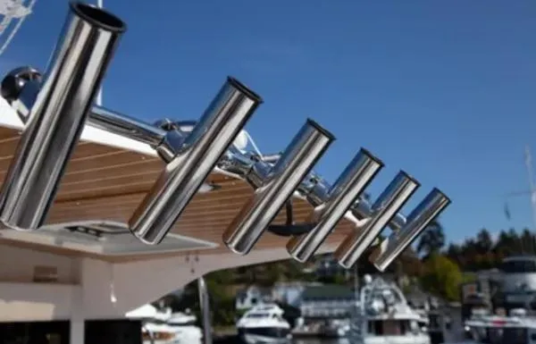  Yacht Photos Pics 2024 Cutwater C-32 C boat with stainless steel rod holders, docked in a marina.