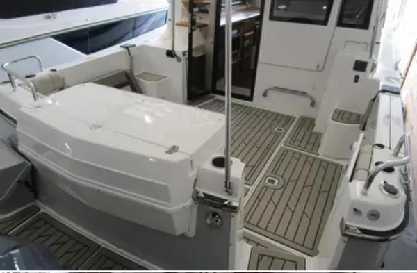  Yacht Photos Pics 2024 Cutwater C-32 C boat interior with sleek design and spacious deck area.