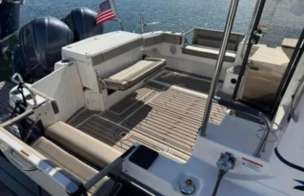  Yacht Photos Pics 2024 Cutwater C-32 C boat deck with seating, American flag, and twin engines.