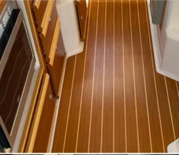  Yacht Photos Pics 2024 Cutwater C-32 C interior with wood flooring and cabinetry.