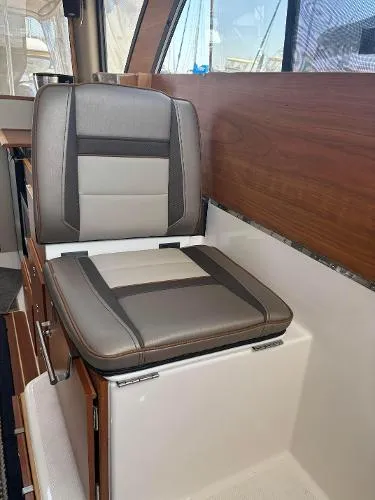  Yacht Photos Pics 2024 Cutwater C-32 C interior seat with modern design and wood accents.