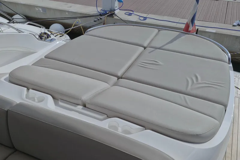  Yacht Photos Pics Luxury sunbed on 2024 Princess V50 yacht, docked at marina.