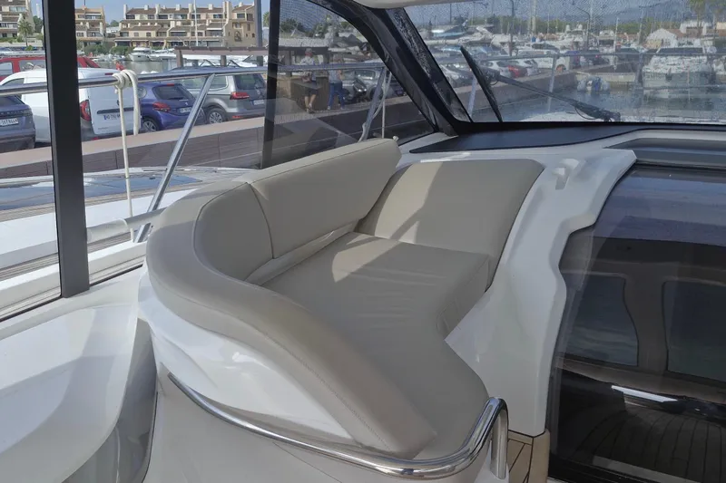  Yacht Photos Pics Luxurious seating area on 2024 Princess V50 yacht, featuring sleek design and comfortable cushions.