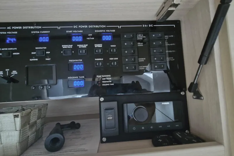  Yacht Photos Pics Control panel of a 2024 Princess V50 yacht, featuring AC and DC power distribution.