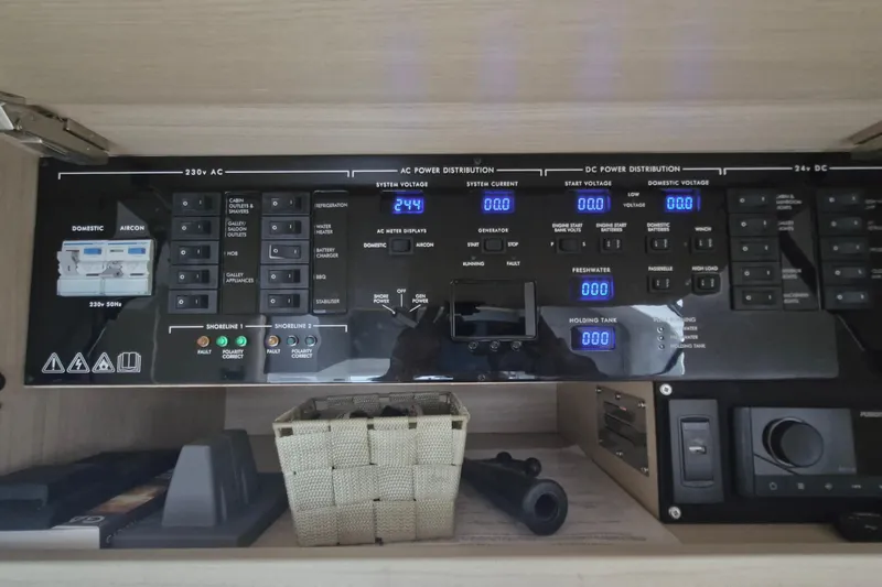  Yacht Photos Pics Electrical control panel of a 2024 Princess V50 yacht, featuring AC and DC power distribution.