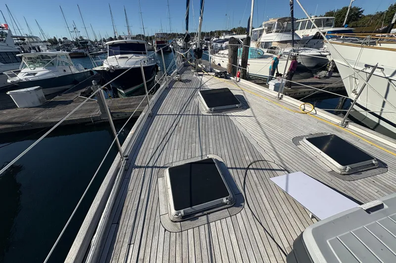 Tenacious Yacht Photos Pics Deck view of a 1987 Mikelson 50 yacht docked at a marina.