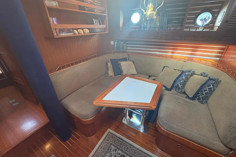 Tenacious Yacht Photos Pics Cozy 1987 Mikelson 50 yacht interior with plush seating and elegant wooden accents.