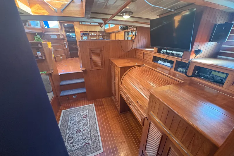 Tenacious Yacht Photos Pics Luxurious 1987 Mikelson 50 yacht interior with wood paneling and modern amenities.
