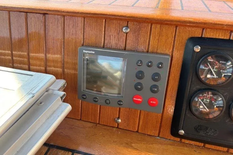 Tenacious Yacht Photos Pics Control panel of a 1987 Mikelson 50 yacht with Raymarine display and gauges.