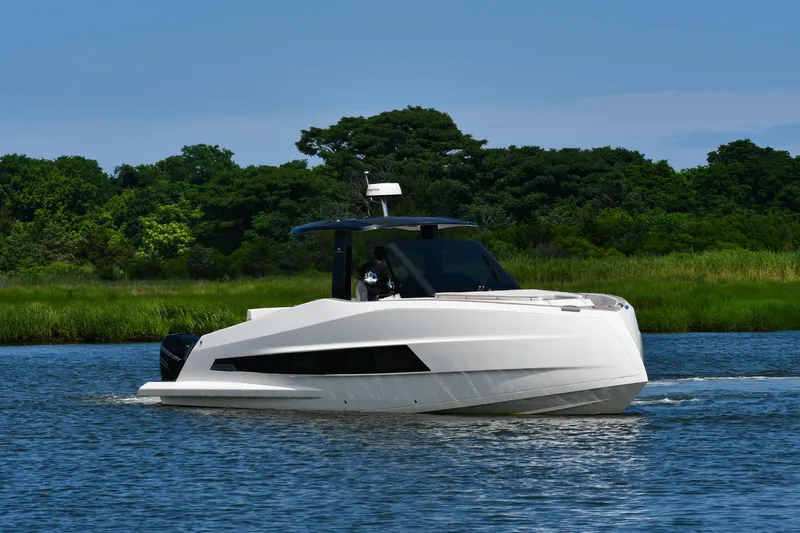  Yacht Photos Pics 2023 Astondoa 377 Coupe Outboard cruising on a serene waterway.