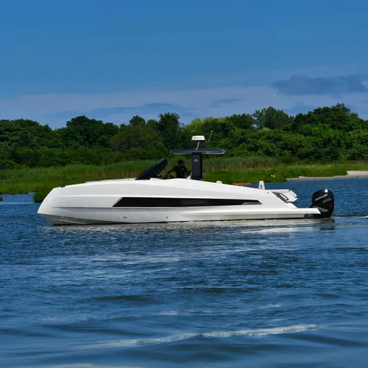  Yacht Photos Pics 2023 Astondoa 377 Coupe Outboard cruising on a serene lake with lush green backdrop.